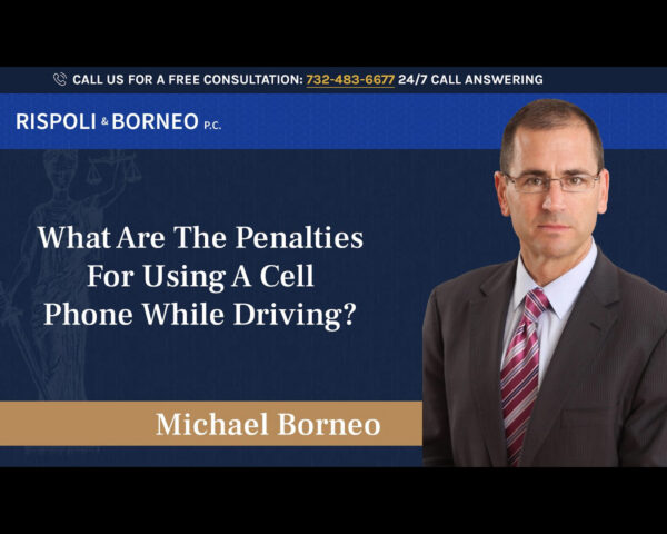 What are the penalties for using a cell phone while driving?